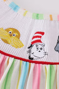 Whimsical striped smocked dress with Dr. Seuss embroidery, perfect for playful adventures.