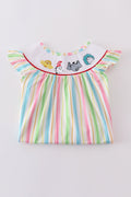 Whimsical striped smocked dress with Dr. Seuss embroidery, perfect for playful adventures.