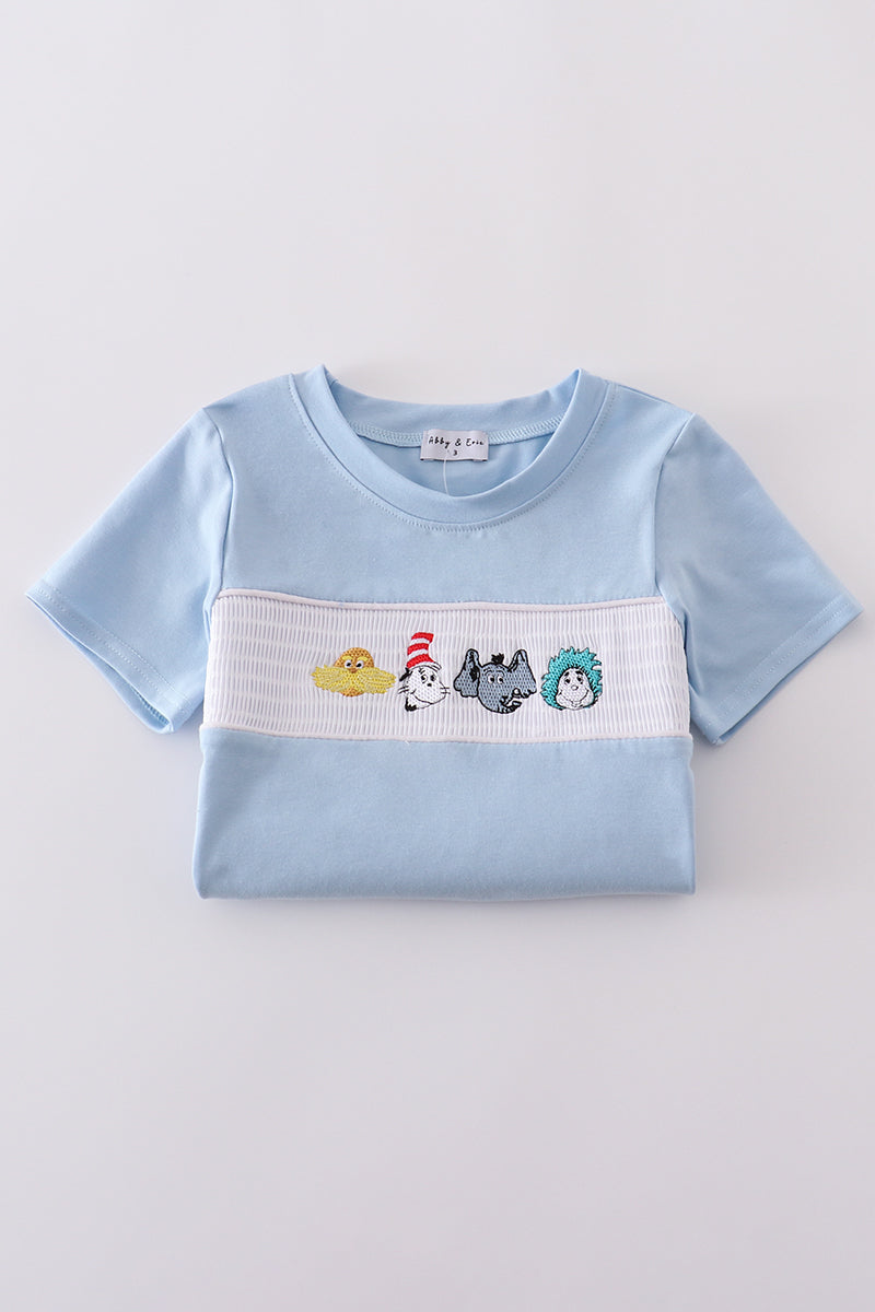 Blue Dr. Seuss smocked top with playful embroidery, perfect for kids.