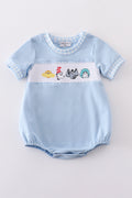 Blue bubble romper with Dr. Seuss embroidery and smocked detailing, perfect for playtime.