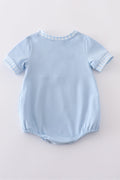 Blue bubble romper with Dr. Seuss embroidery and smocked detailing, perfect for playtime.