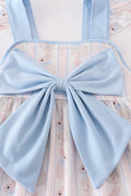 Adorable blue dress with bunny print and a charming bow, perfect for spring.