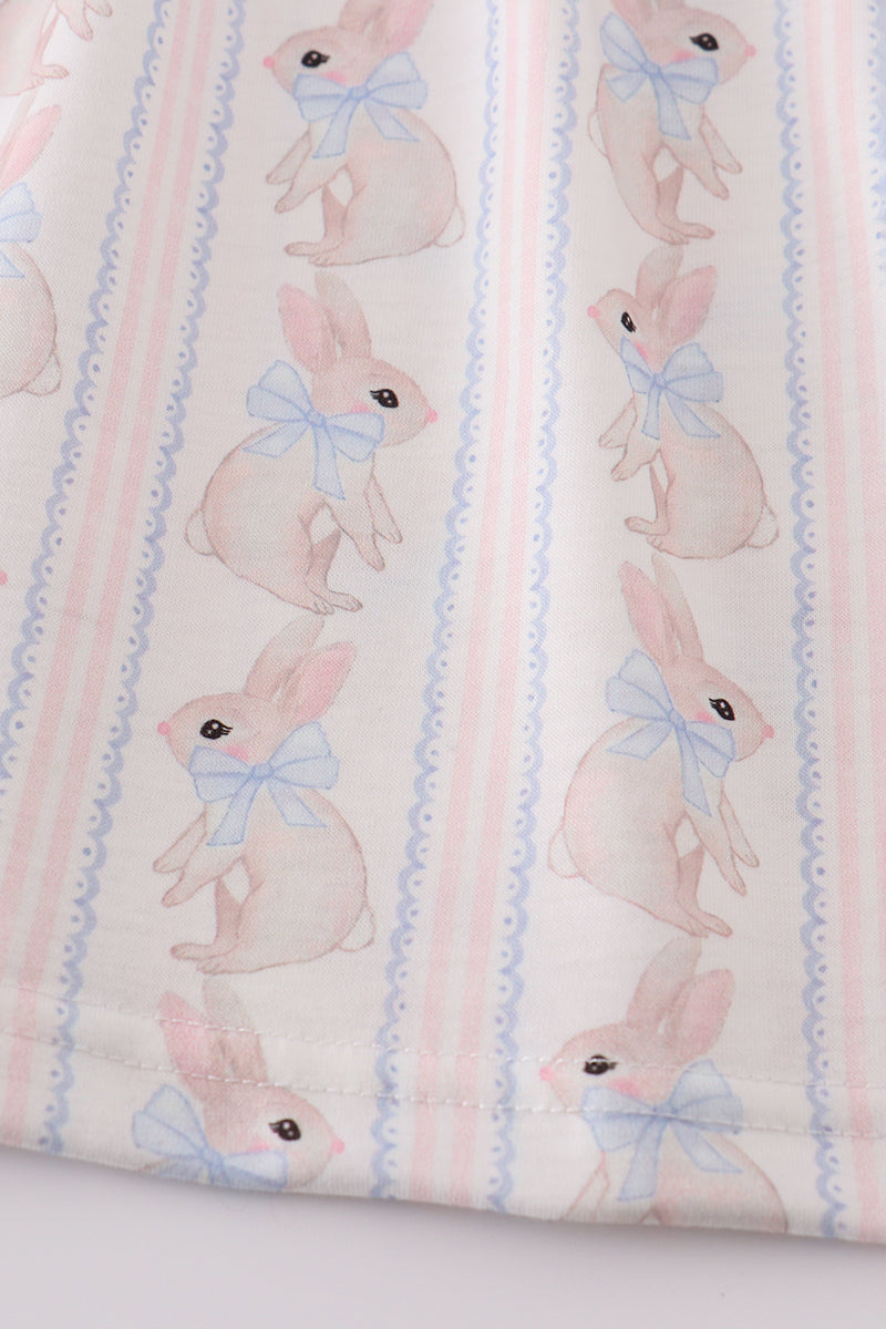 Adorable blue dress with bunny print and a charming bow, perfect for spring.