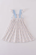 Adorable blue dress with bunny print and a charming bow, perfect for spring.