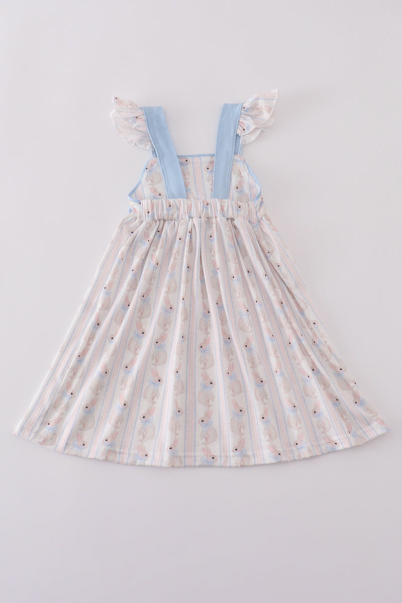 Adorable blue dress with bunny print and a charming bow, perfect for spring.
