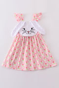 A charming pink dress with a floral bunny applique, perfect for springtime play.