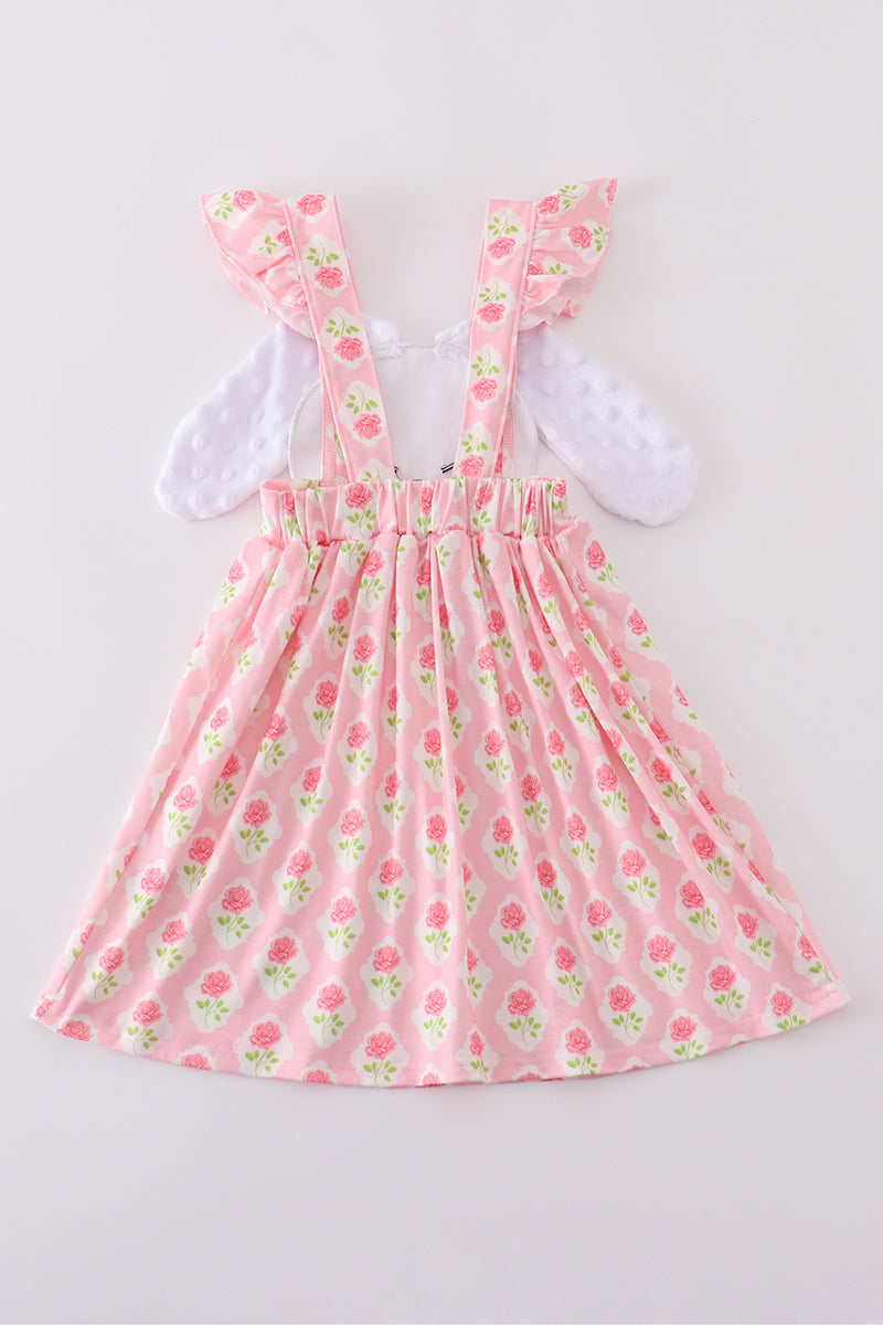 A charming pink dress with a floral bunny applique, perfect for springtime play.