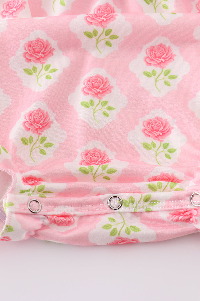 Pink floral bunny applique bubble romper with ruffled sleeves, perfect for spring.