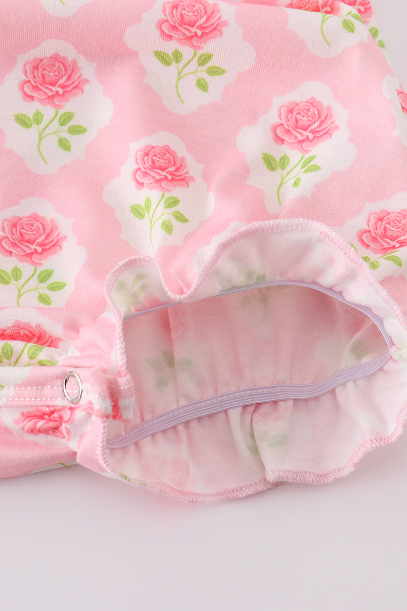Pink floral bunny applique bubble romper with ruffled sleeves, perfect for spring.