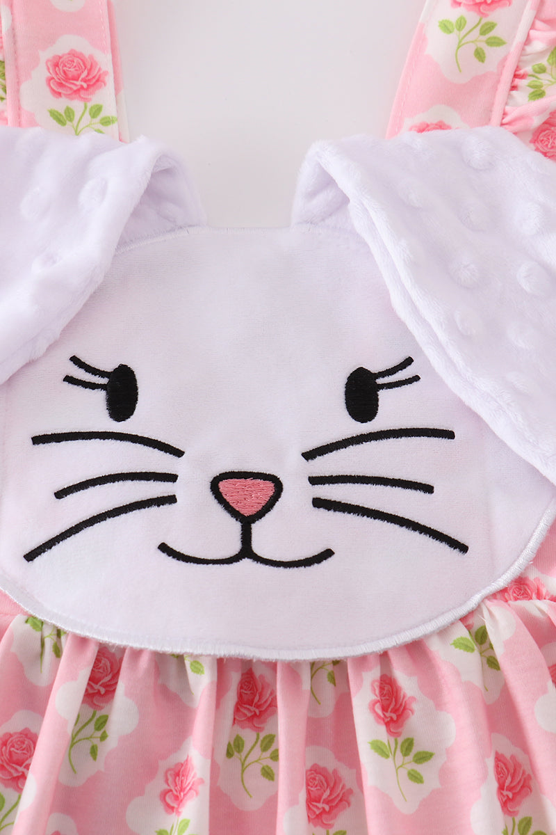Pink floral bunny applique bubble romper with ruffled sleeves, perfect for spring.