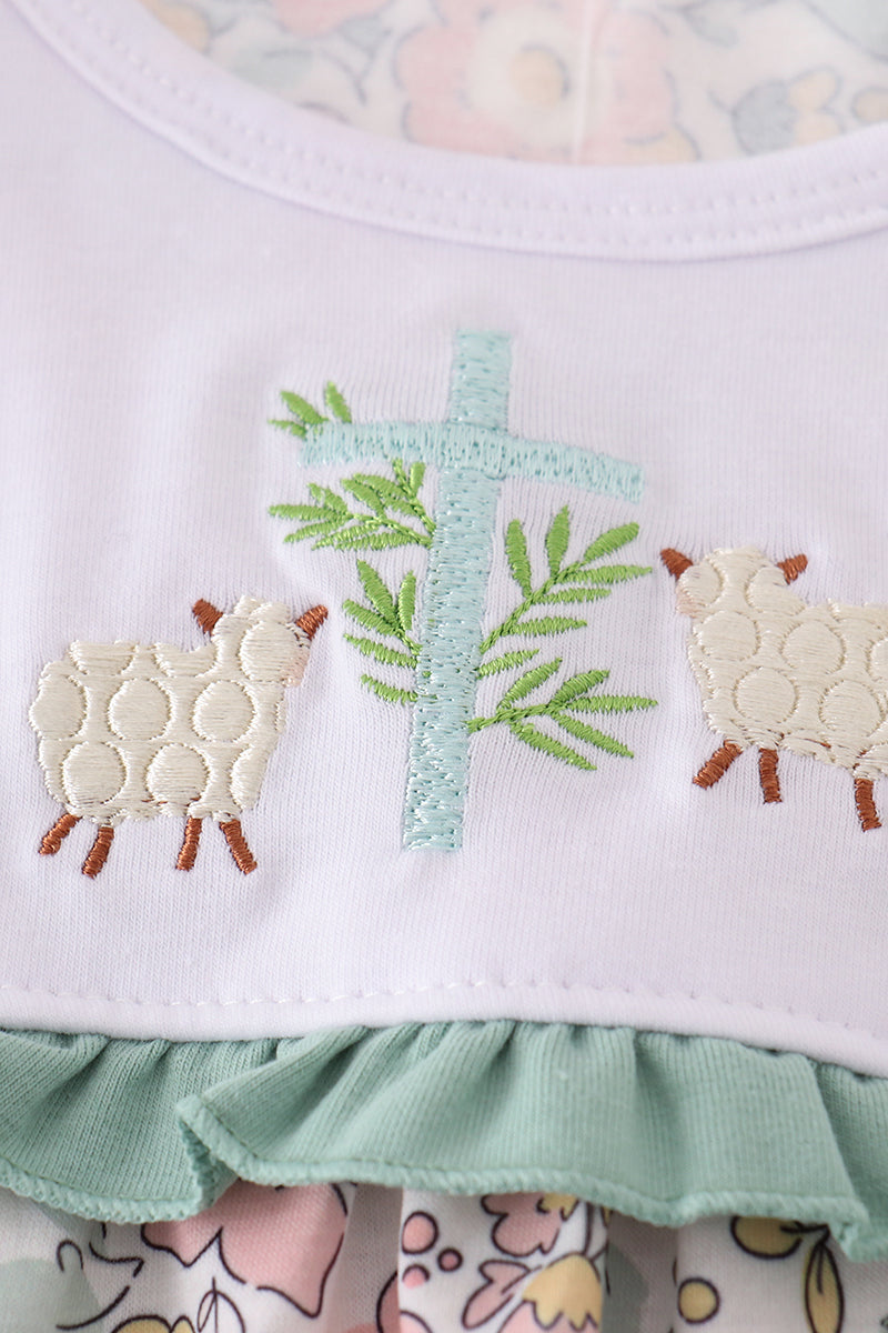 A charming floral sheep dress with cross embroidery, perfect for playful outings.