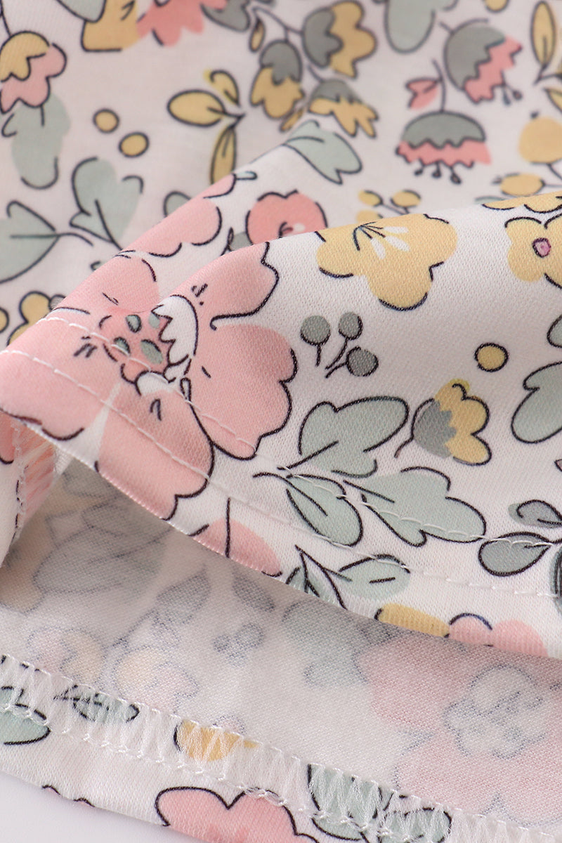 A charming floral sheep dress with cross embroidery, perfect for playful outings.