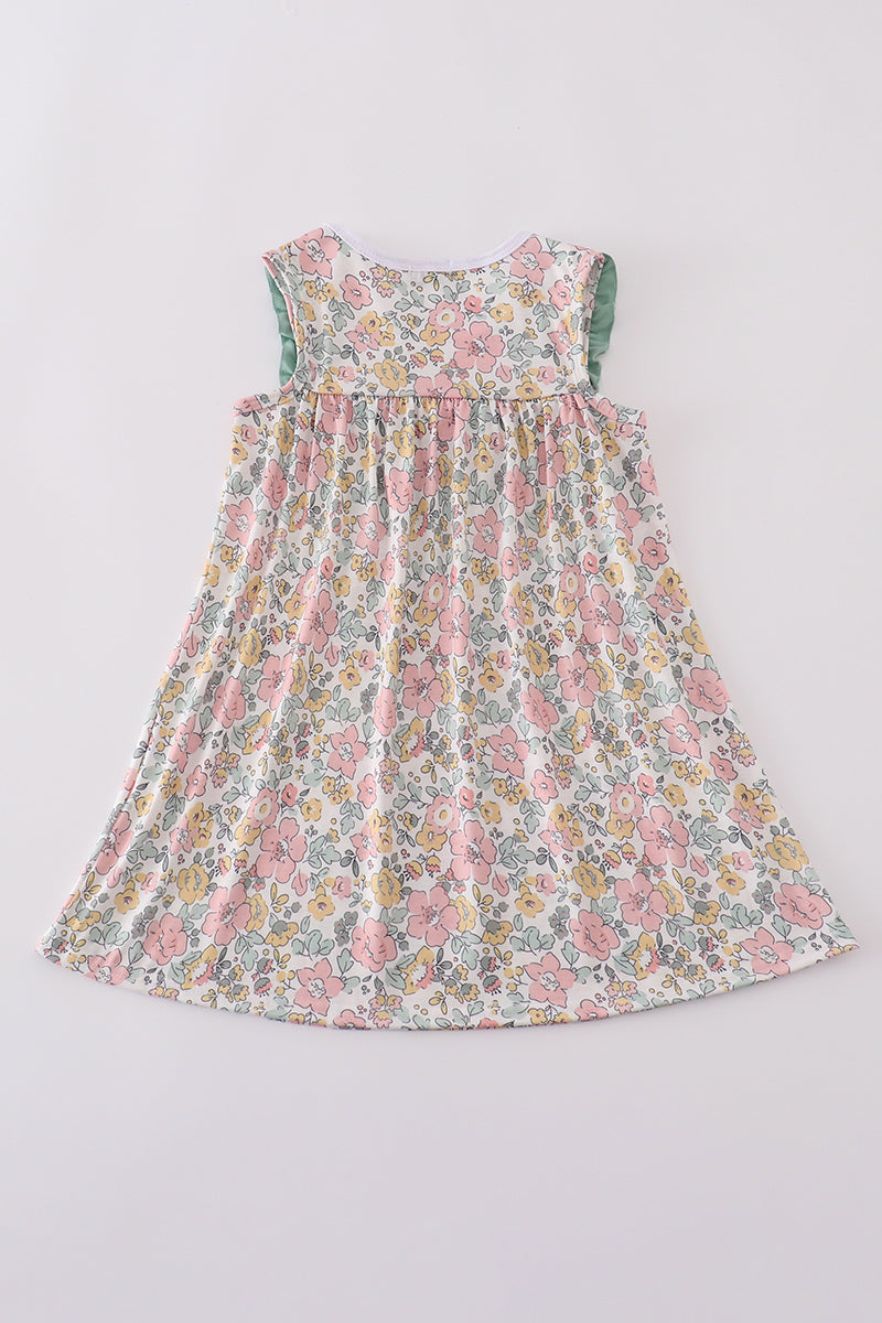 A charming floral sheep dress with cross embroidery, perfect for playful outings.