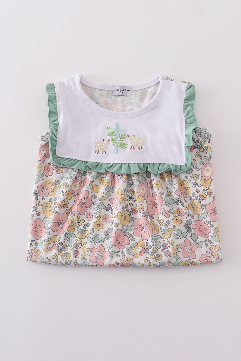 A charming floral sheep dress with cross embroidery, perfect for playful outings.