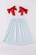 A charming blue dress with flag embroidery, perfect for playful summer days.