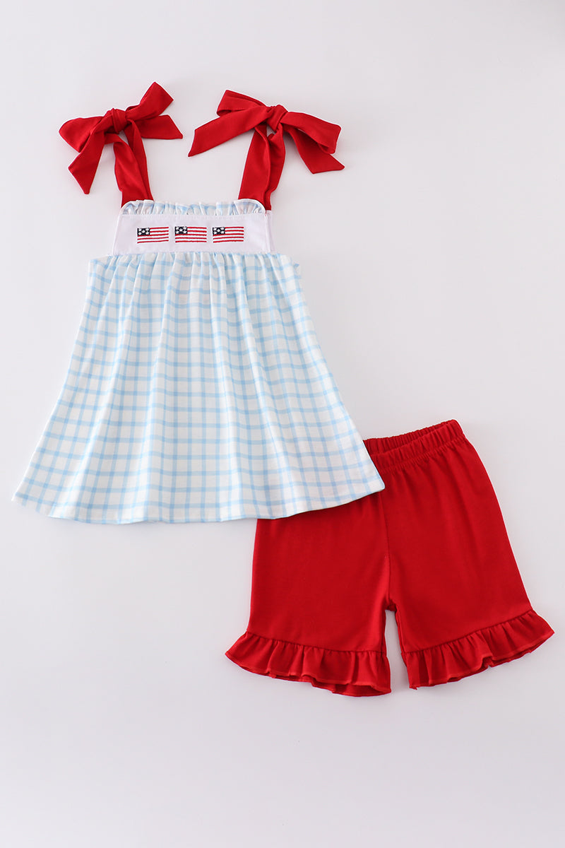 Blue flag embroidery set: cozy children's outfit with playful flag patterns.