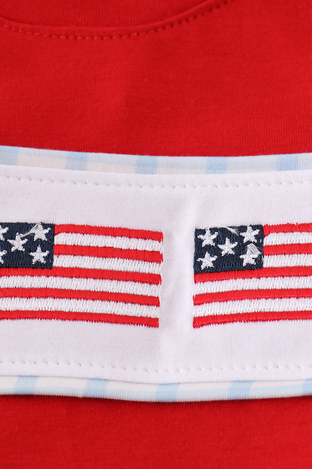 Children's blue flag embroidery set: cozy top and pants with playful flag patterns.