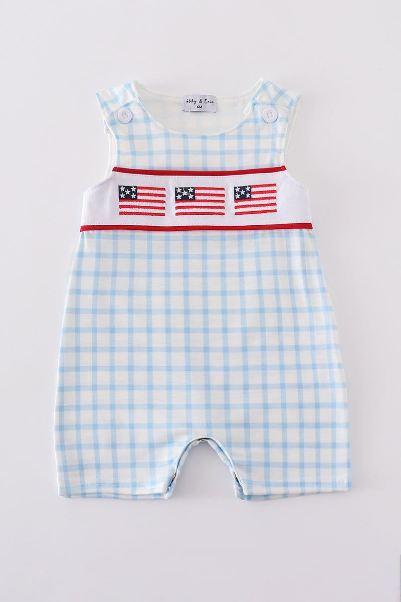 Blue jonjon with charming flag embroidery, perfect for playful summer adventures.