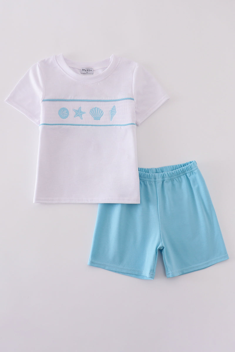 White smocked set with starfish embroidery, perfect for summer beach outings.