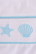 White smocked set with starfish embroidery, perfect for summer beach outings.