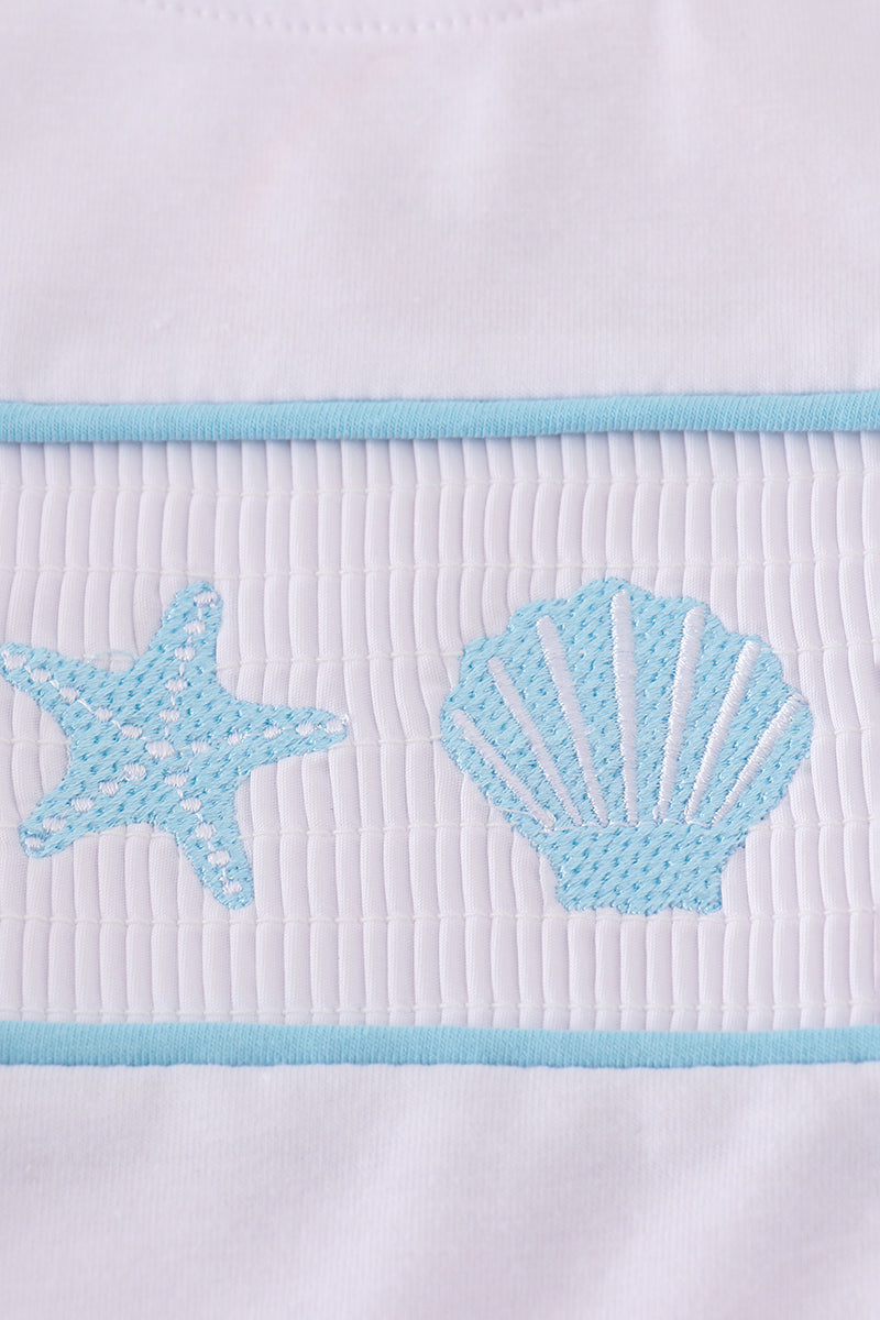 White smocked set with starfish embroidery, perfect for summer beach outings.