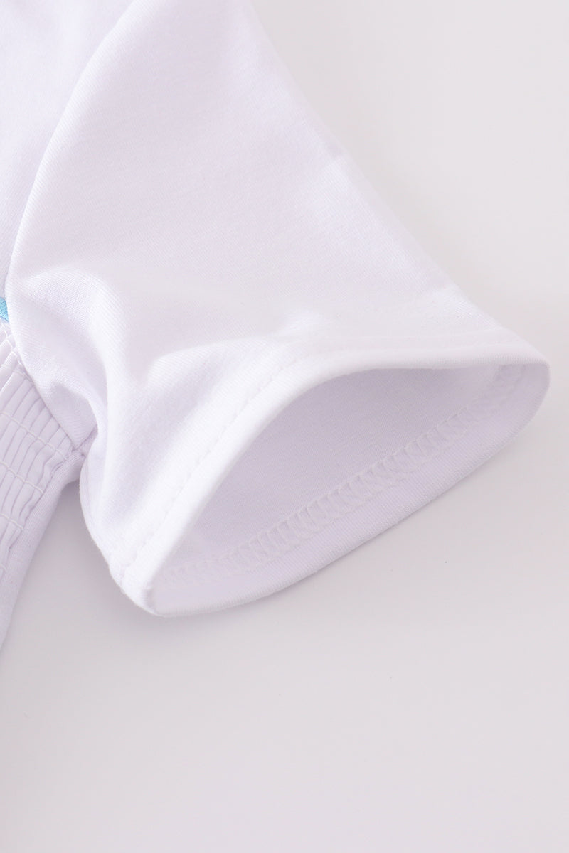 White smocked set with starfish embroidery, perfect for summer beach outings.