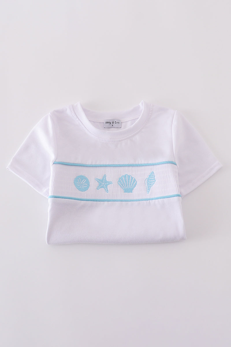 White smocked set with starfish embroidery, perfect for summer beach outings.