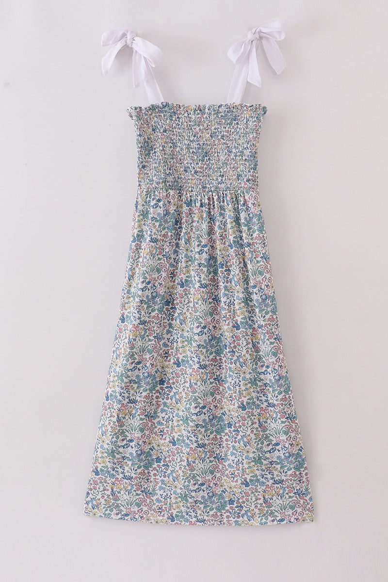 A charming smocked mom dress with a vintage meadow floral print.