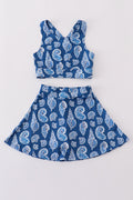 Blue conch print tennis skort set with playful ocean-themed pattern.