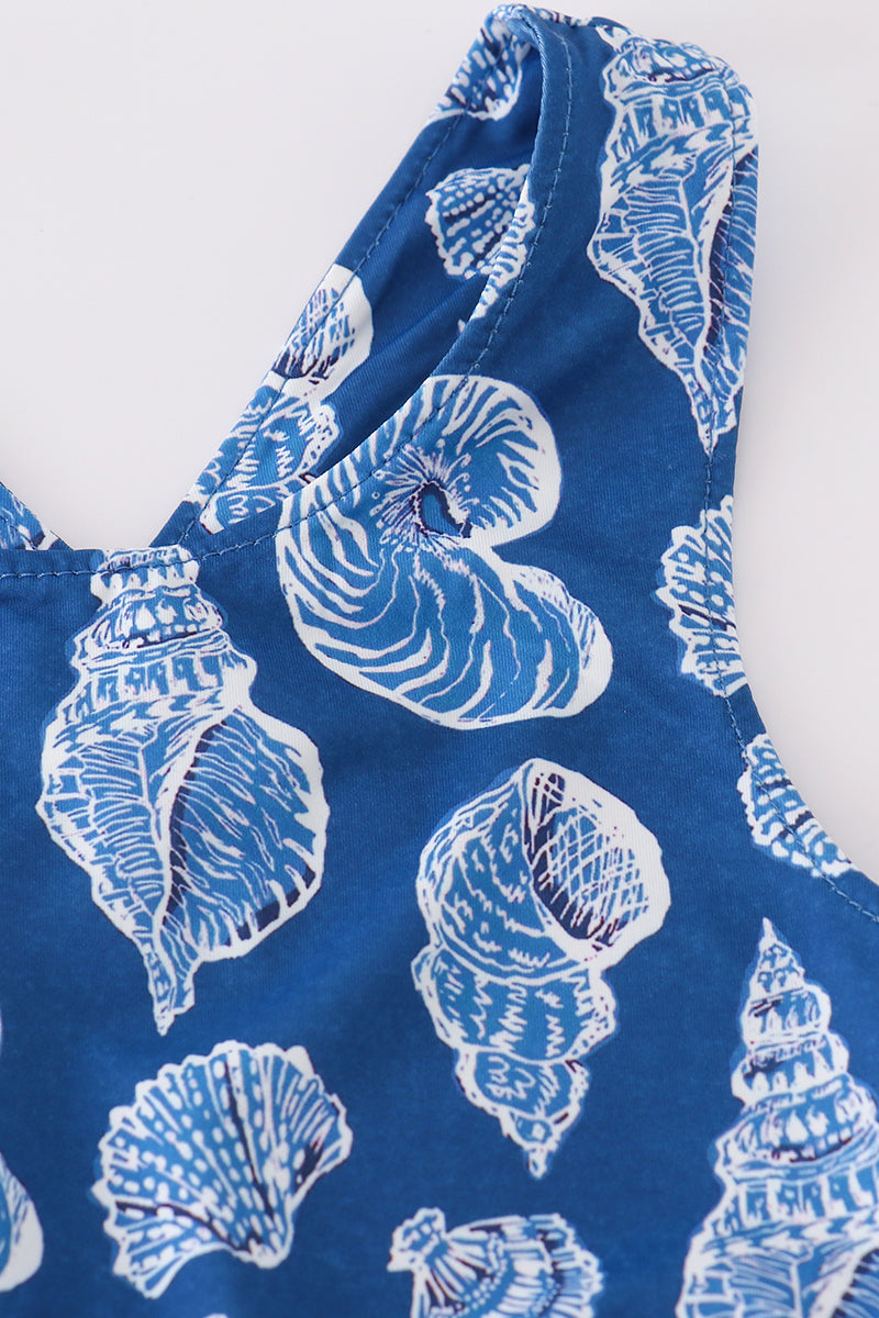 Blue conch print tennis skort set with playful ocean-themed pattern.