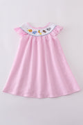Pink seersucker dress with playful animal embroidery, perfect for spring outings.