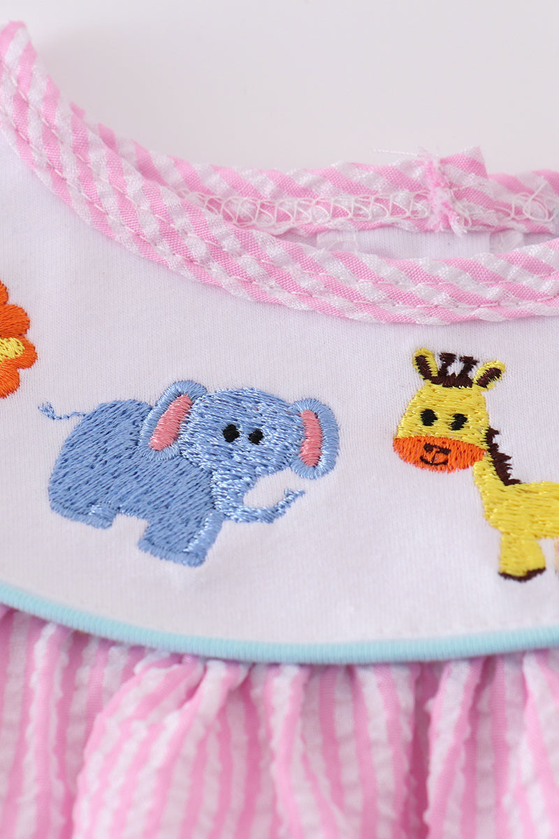 Pink seersucker dress with playful animal embroidery, perfect for spring outings.
