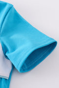 Blue seersucker set with playful animal embroidery, perfect for kids' summer adventures.