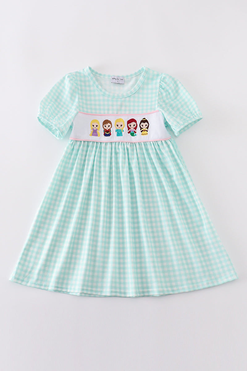 Blue gingham dress with princess embroidery, perfect for a playful, charming look.