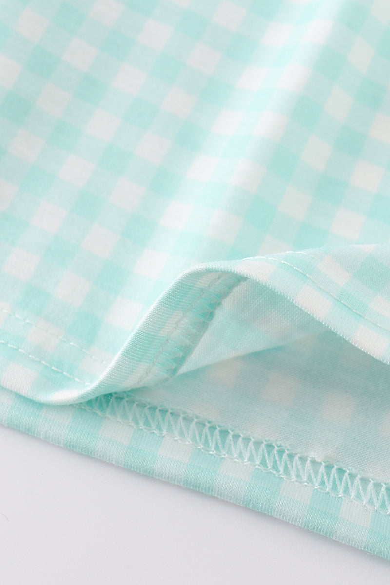 Blue gingham dress with princess embroidery, perfect for a playful, charming look.