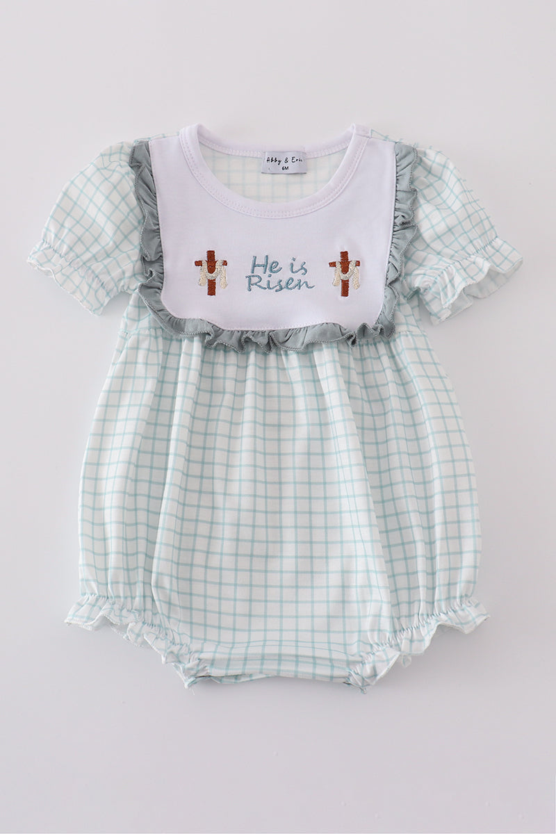 Blue bubble romper with "He is Risen" embroidery, perfect for Easter celebrations.