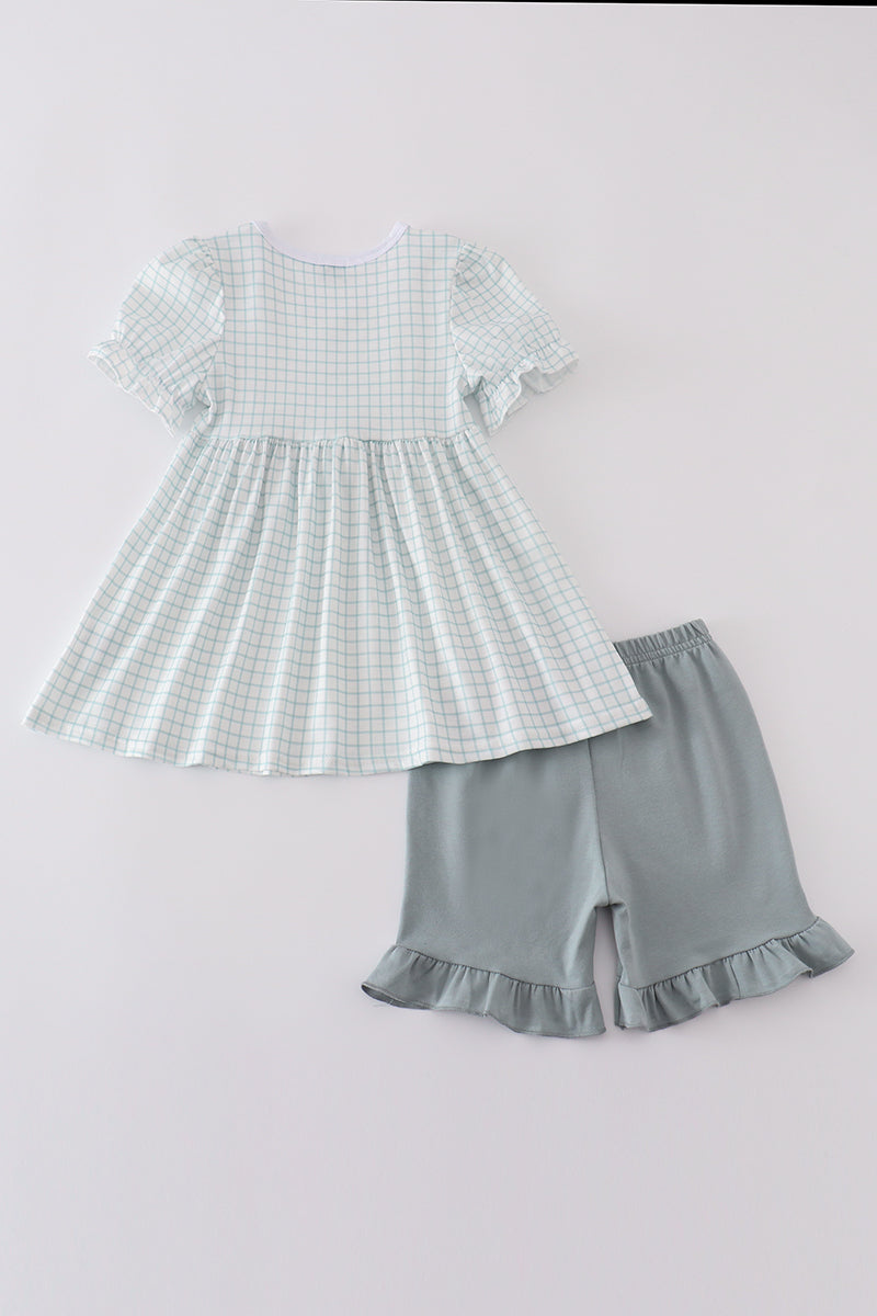 Blue children's outfit with "He is Risen" embroidery, perfect for Easter celebrations.