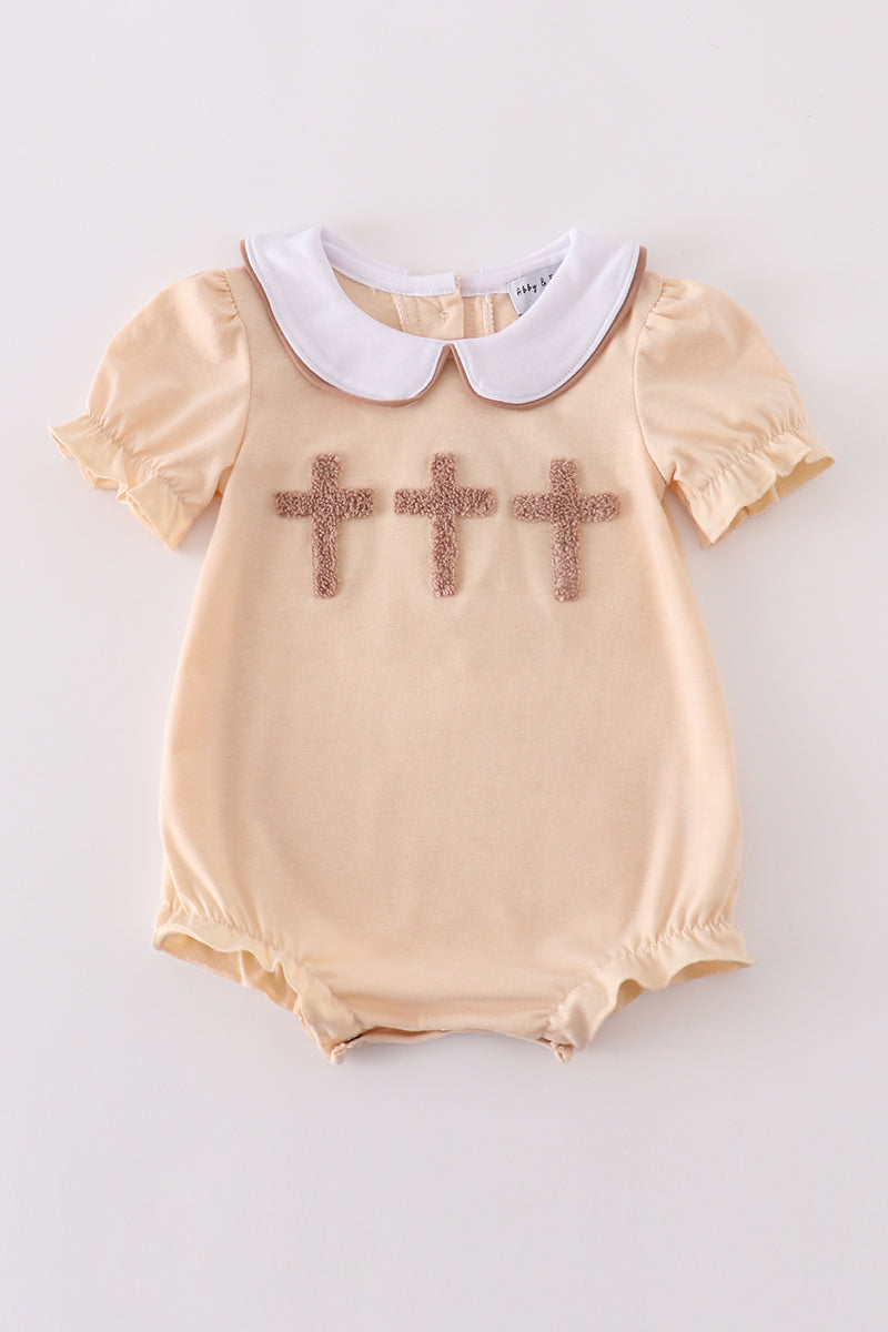 Cream cross french knot bubble romper with delicate embroidery, perfect for special occasions.