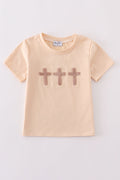 Cream top with delicate cross-stitch knots, perfect for everyday play.