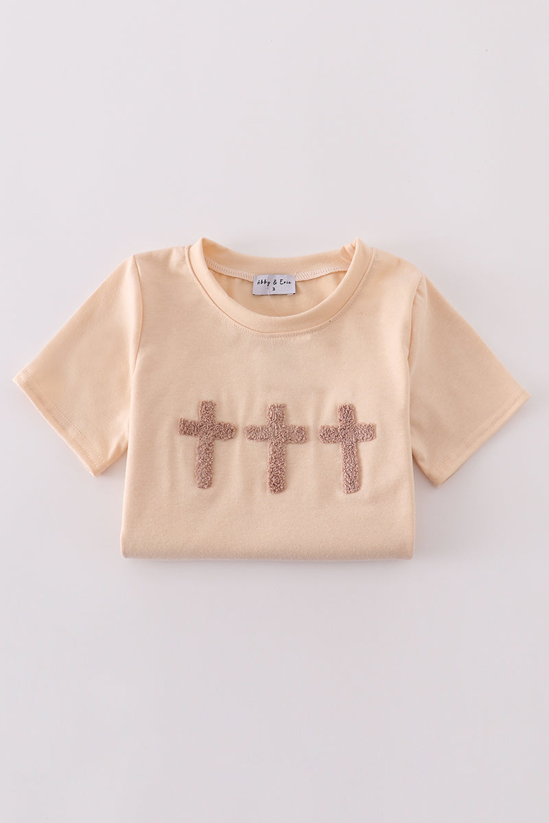 Cream top with delicate cross-stitch knots, perfect for everyday play.