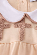 Cream bubble romper with delicate cross French knot embroidery, perfect for special occasions.