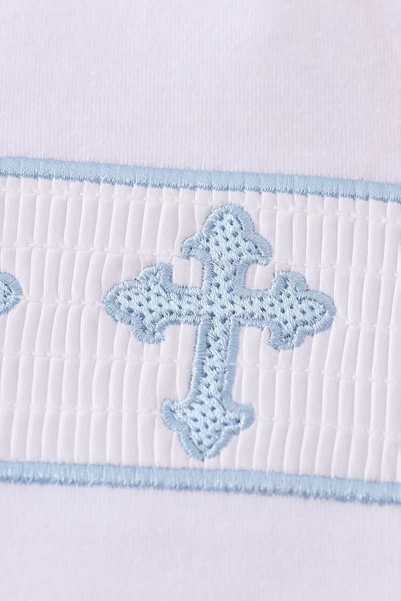 A charming blue smocked set with cross embroidery, perfect for special occasions.