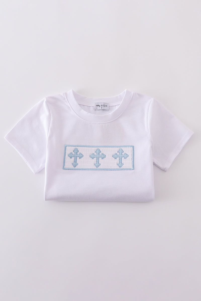 A charming blue smocked set with cross embroidery, perfect for special occasions.