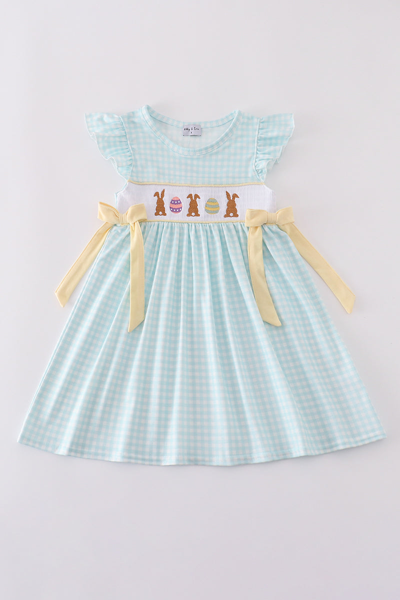 Blue smocked dress with adorable bunny embroidery, perfect for Easter celebrations.