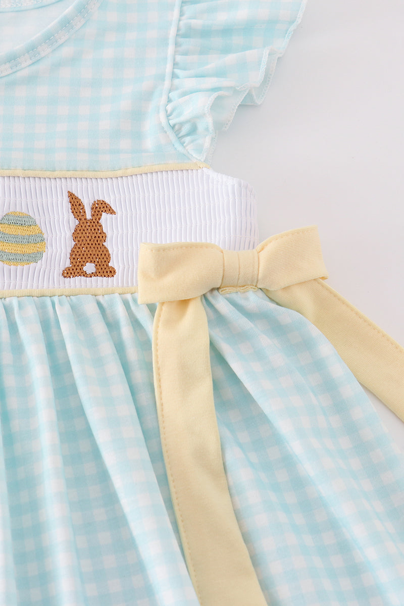 Blue smocked dress with adorable bunny embroidery, perfect for Easter celebrations.