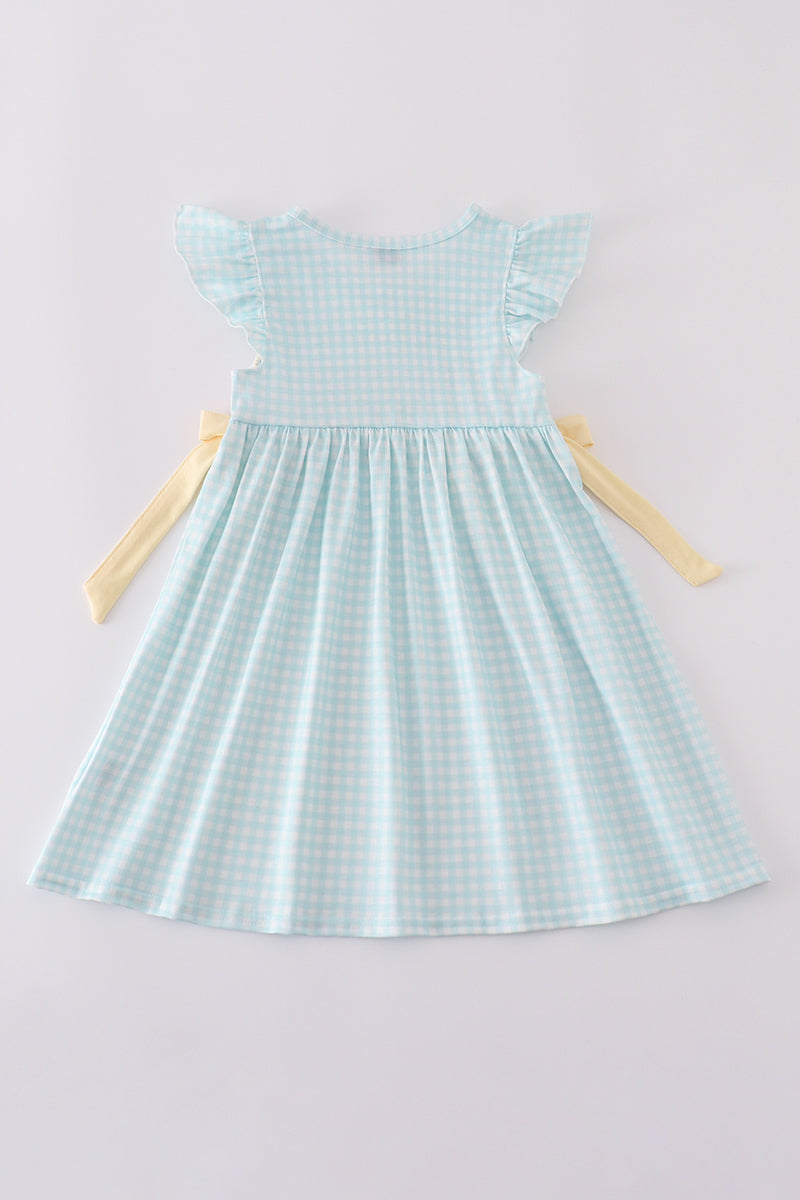 Blue smocked dress with adorable bunny embroidery, perfect for Easter celebrations.