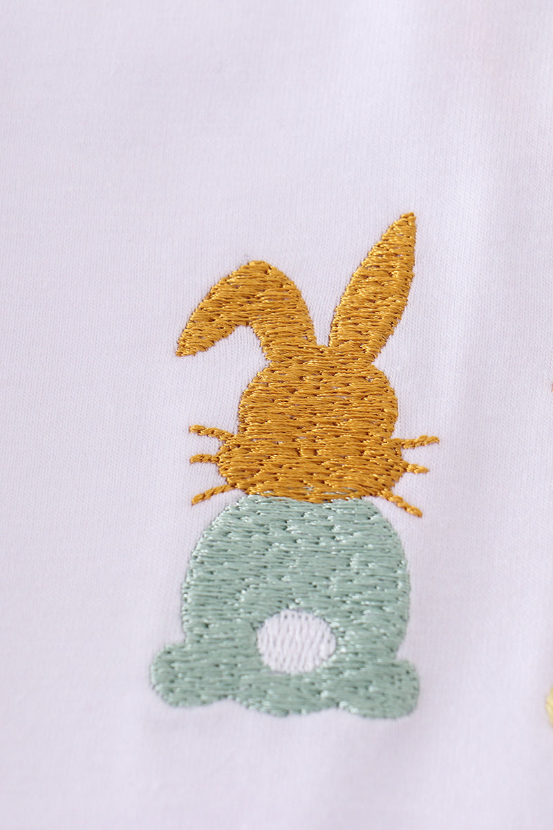 Easter bunny embroidery set with pastel colors on a cozy children's sweater.