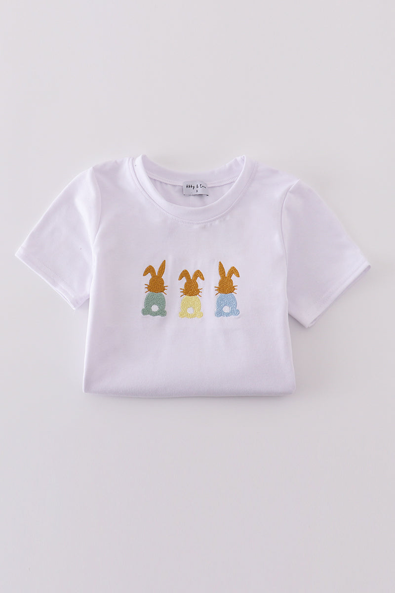 Easter bunny embroidery set with pastel colors on a cozy children's sweater.
