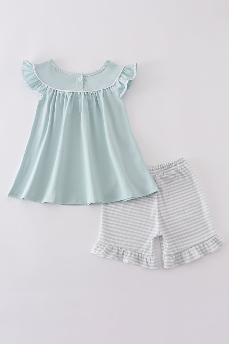 Blue cross embroidery set: cozy children’s outfit with charming cross-stitch pattern.