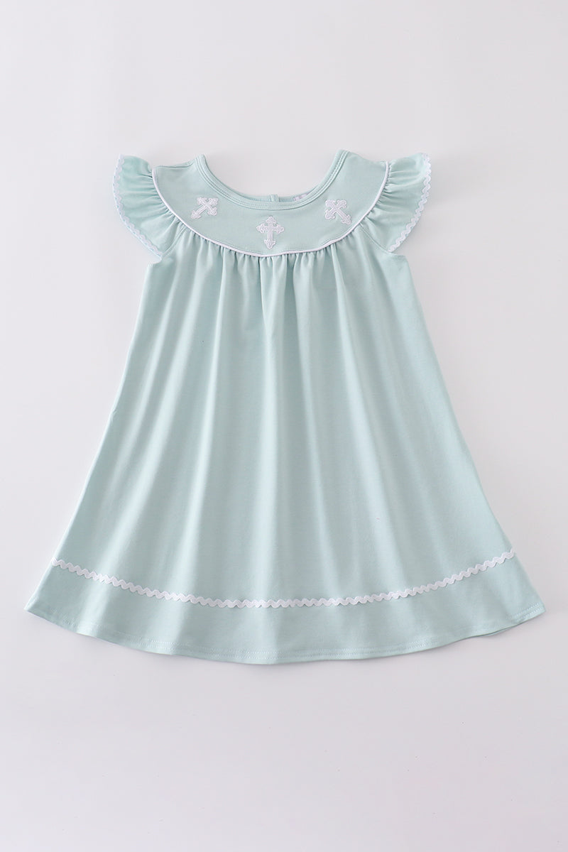 Blue cross embroidery dress for children, featuring playful patterns and soft fabric.